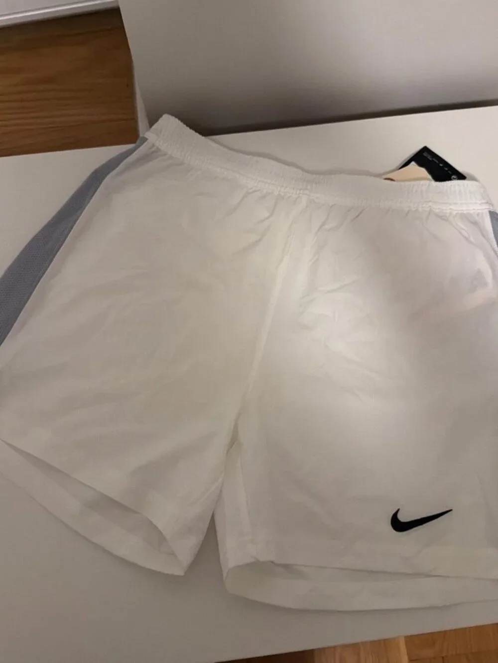 Nike white shorts with gray side panels